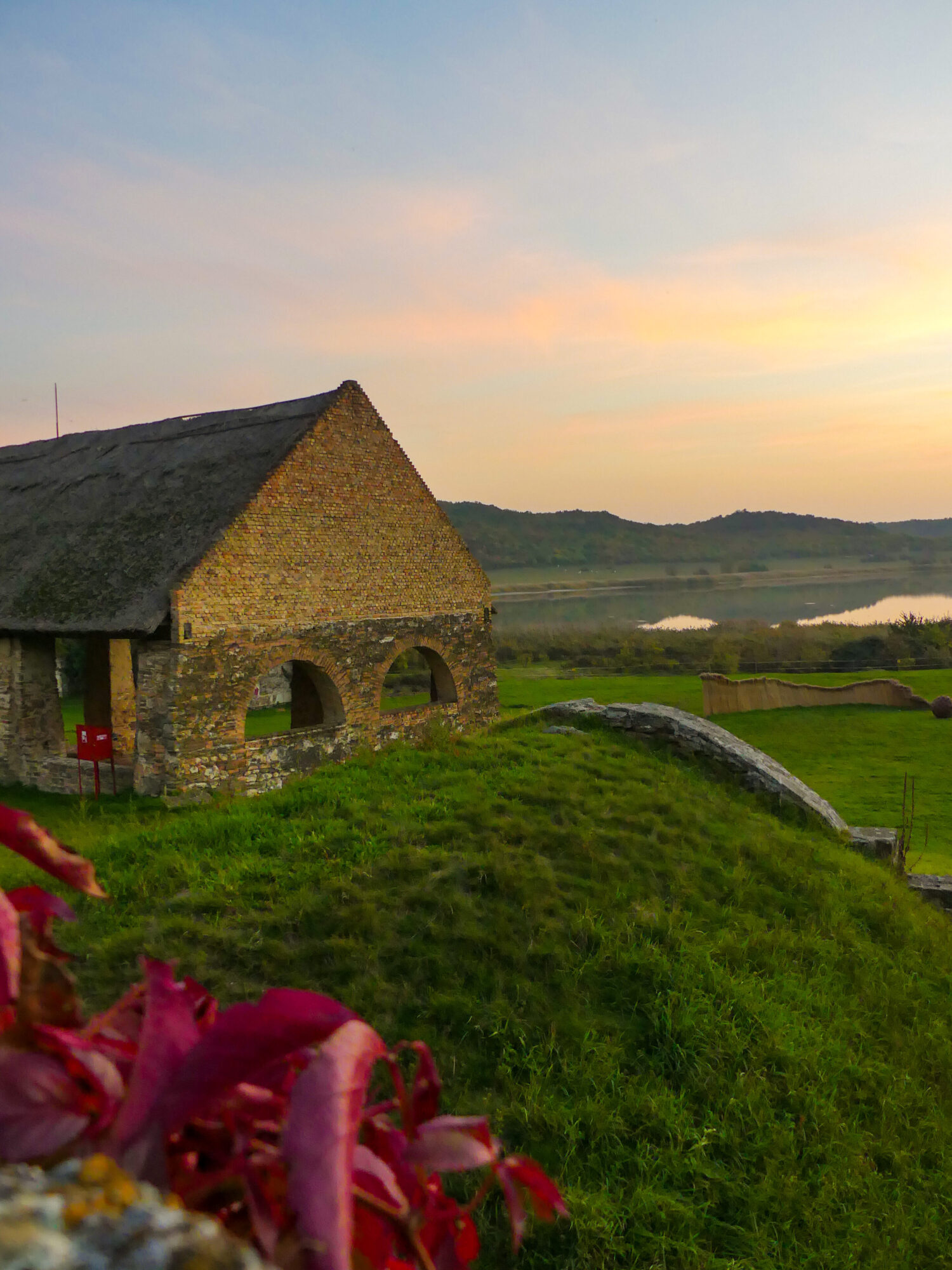 Old building made of stones by the lake shore