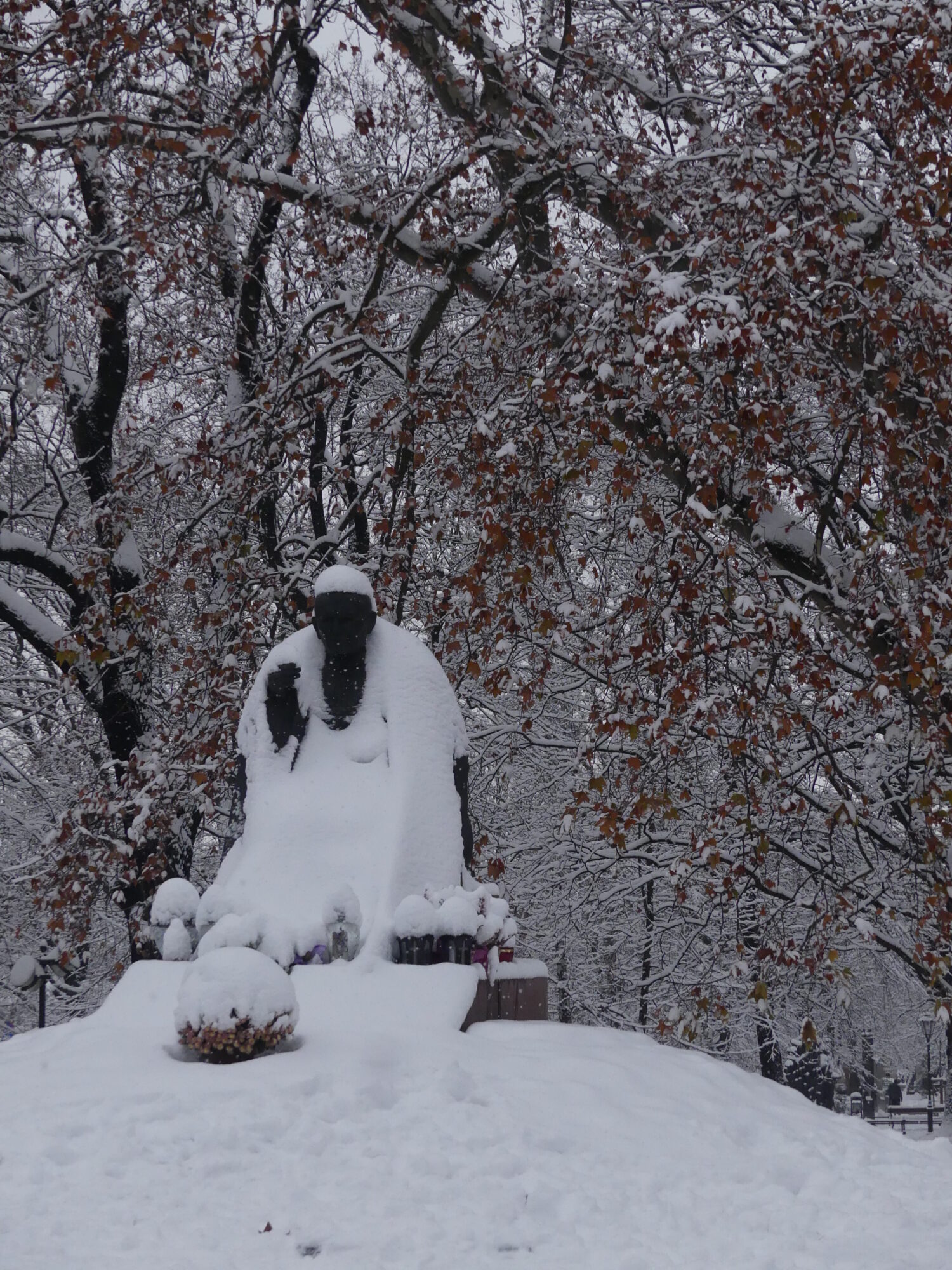 Statue of Pope John Paul II under the snow