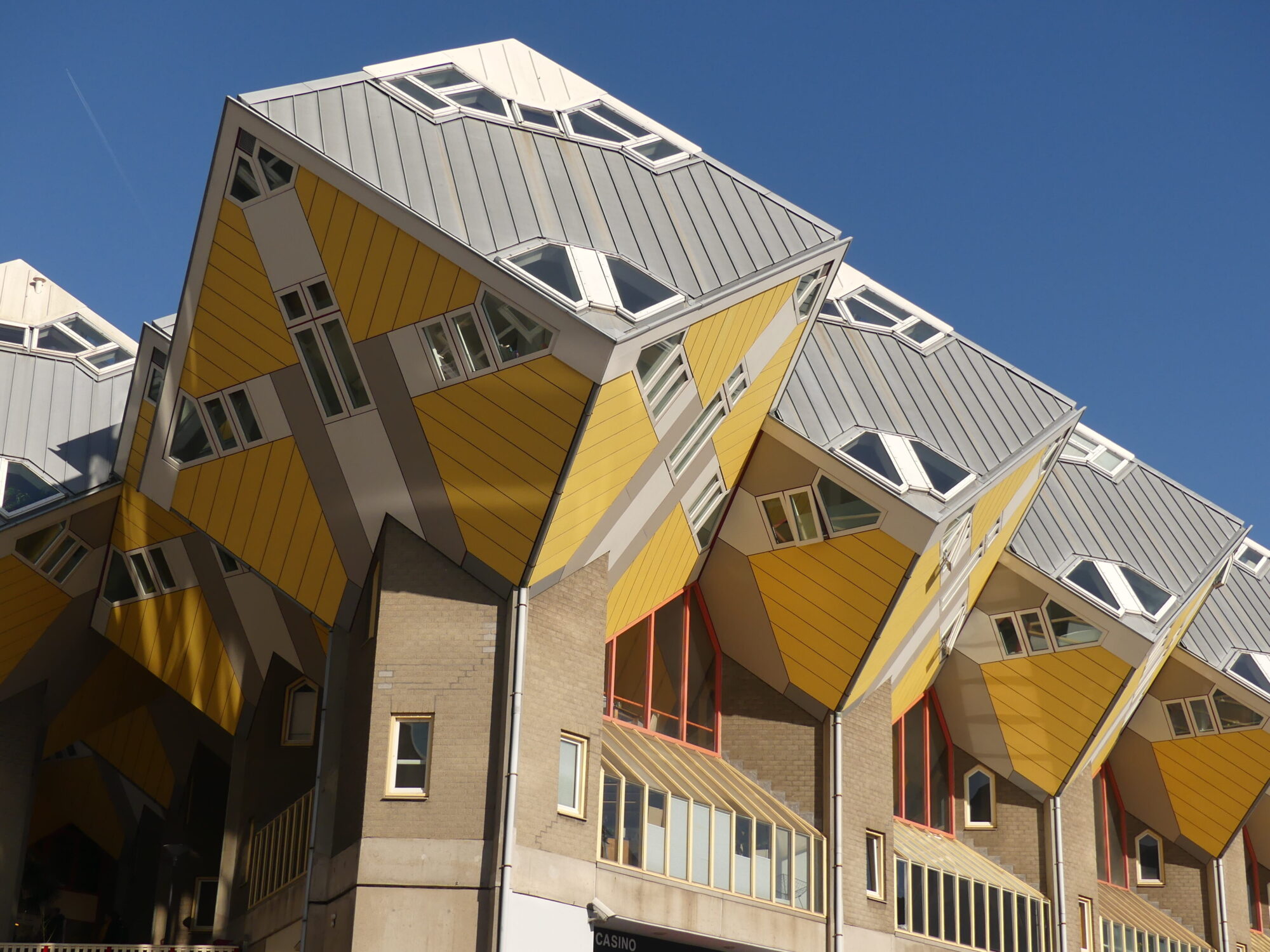 The Cubic Houses in Rotterdam. Buildings with yellow and grey cubes on top.