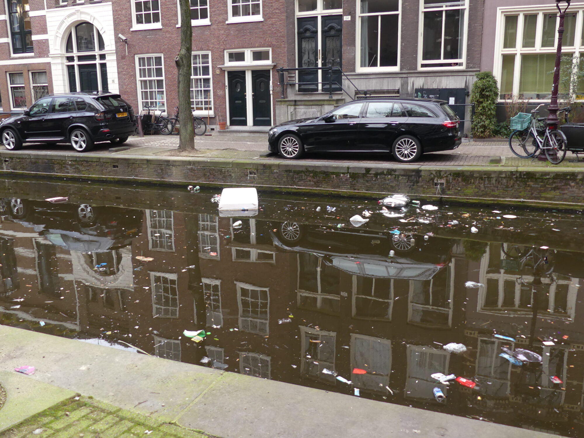 A lot of floating rubbish on the canal